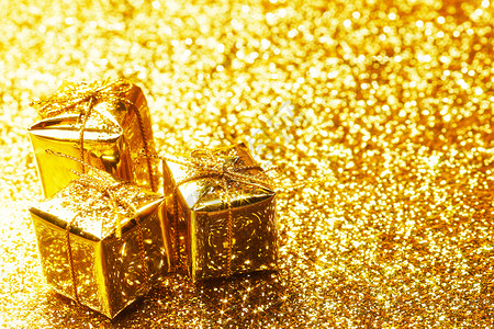 黄金装饰盒与节日礼物抽象黄金背景图片