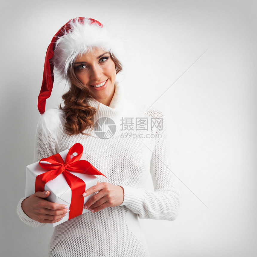 轻的快乐女人戴着诞礼物盒诞女孩着诞礼物图片