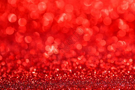 红色闪烁的灯光抽象假日背景与红色闪烁的灯光背景图片