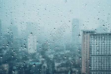 雨水滴窗户璃纹理上,背景摩天大楼雨点落窗户上图片