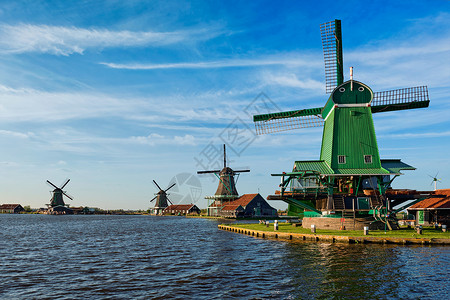 弗兰斯科荷兰著名的旅游景点ZaanseSchans的荷兰乡村兰斯克风磨坊Zaandam,荷兰日落时荷兰的赞斯山的风车赞丹姆背景