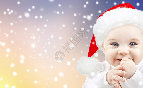 诞节,假日人的小男孩诞帽雪背景诞节戴诞帽的小男孩背景图片