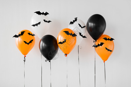 节日,装饰派橙色,黑白空气万节气球与黑色蝙蝠白色背景万节派气球与黑色蝙蝠图片