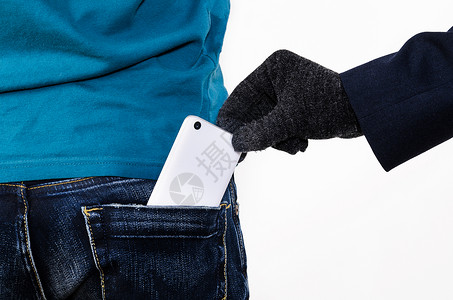 扒窃口袋里手机把现代智能手机口袋里出来背景