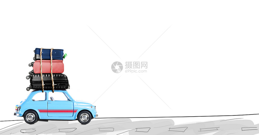 开车旅行蓝色复古玩具汽车与旅行箱路上图片