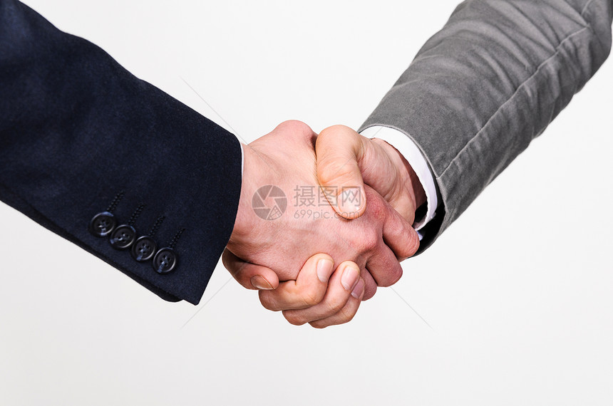 两个商人握手两个商人灰色背景下握手图片