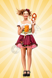 漂亮感的啤酒节女服务员,穿着传统的巴伐利亚连衣裙,图片