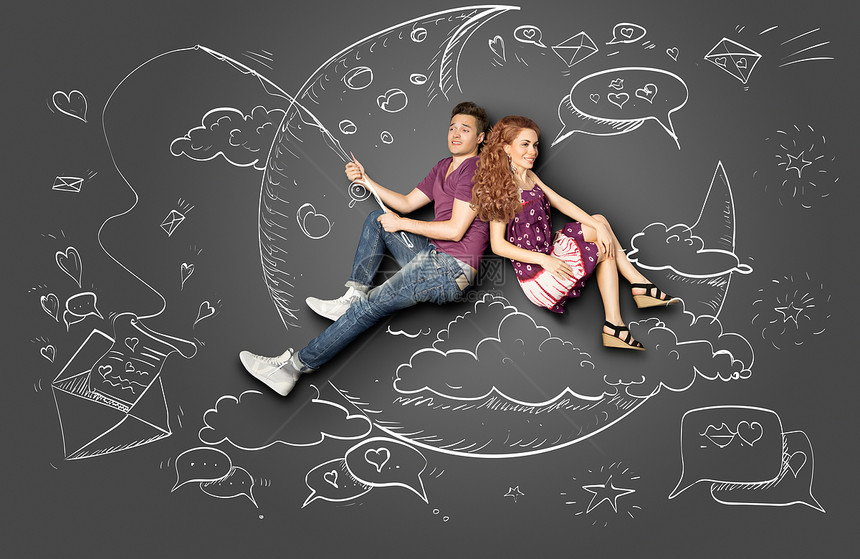 快乐情人节的爱情故事,浪漫的夫妇月亮上钓鱼,用粉笔画背景的钩子上封纸信图片