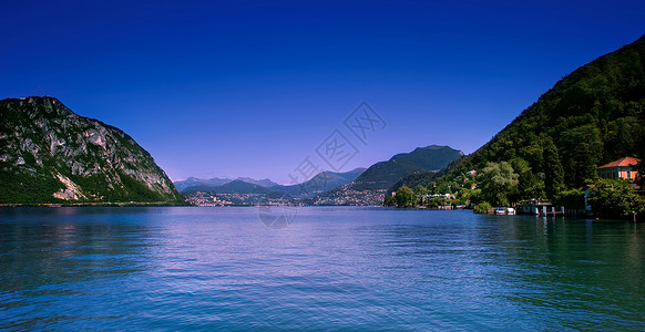 瑞士蒂奇诺卢加诺市海岸线湖泊的风景背景图片