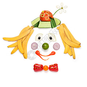 马戏小丑个创造的食物,展示了个微笑小丑的肖像,由蔬菜水果制成的菜单为儿童背景