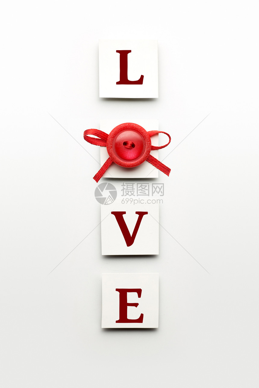 创意情人节照片的爱标志装饰个按钮蝴蝶结白色背景图片