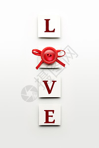 创意情人节照片的爱标志装饰个按钮蝴蝶结白色背景图片