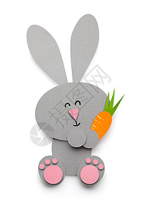 创意复活节照片的兔子与胡萝卜制成的纸白色背景背景