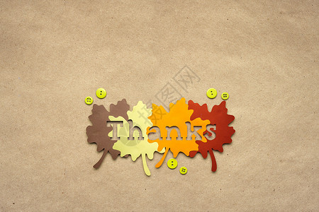 创意感恩节照片的叶子制成的纸张棕色背景图片