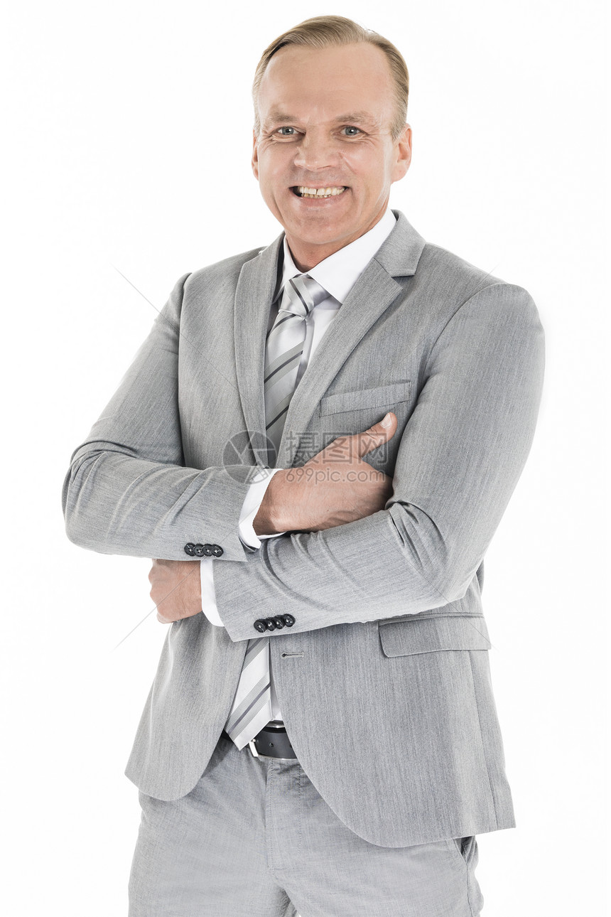 微笑的成熟商人微笑的成熟商人的肖像,穿着灰色西装,孤立白色背景上图片