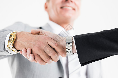 商业伙伴的握手商业伙伴握手后,达成交易,近距离观看图片