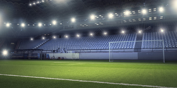 灯光下的足球场空足球绿场的背景图像图片