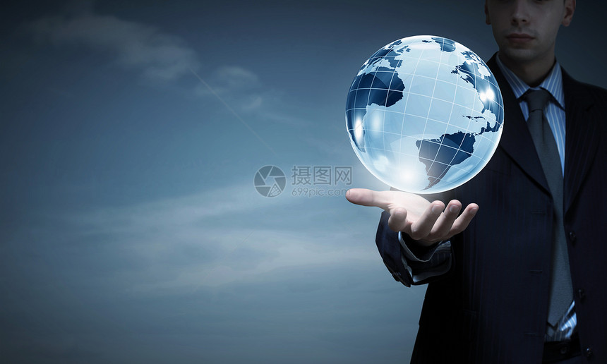 商人的手数字地球仪商业未来技术理念图片