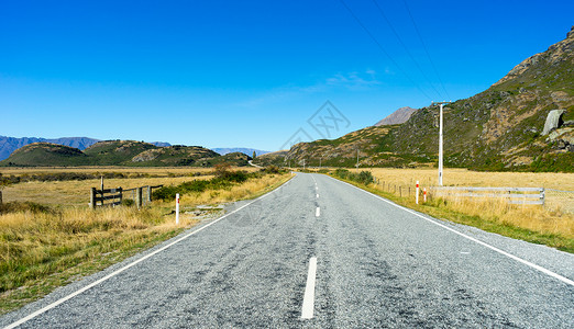 遥远乡村道路风景如画新西兰阿尔卑斯山道路的自然景观背景