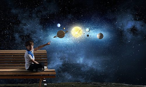 探索太空的男孩可爱的学校男孩坐长凳上,用手指指着行星图片