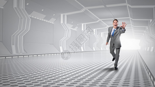 男人跑着伸手轻尖叫的商人未来的隧道里奔跑图片