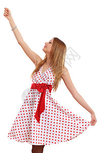 穿红裙子的女人穿着红色连衣裙的漂亮的金发女郎背景图片