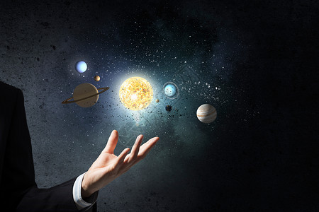 太阳系统的行星人类手中的行星太阳系统图片