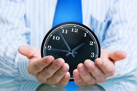 手托着时钟你的时间保护优化商人的手着小心的时间背景