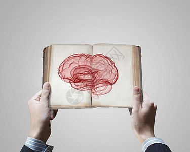 精神能力特写男的手,着打开的书大脑图片图片
