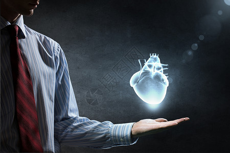 心脏护理的紧紧地握住人类的心图片