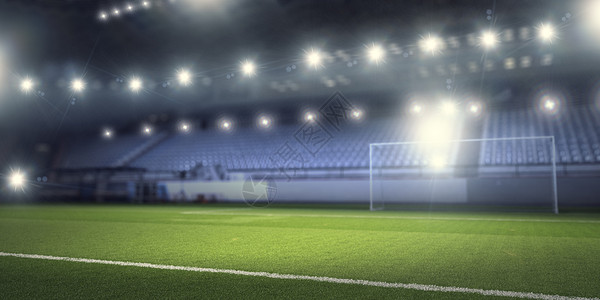 灯光下的足球场空足球绿场的背景图像背景图片
