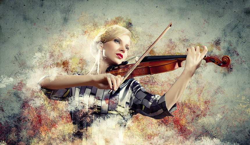 漂亮的女人拉小提琴美丽的女小提琴手五颜六色的背景下演奏的形象图片