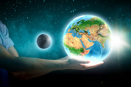 地球行星紧紧握住地球行星的人的手这幅图像的元素由美国宇航局提供的图片