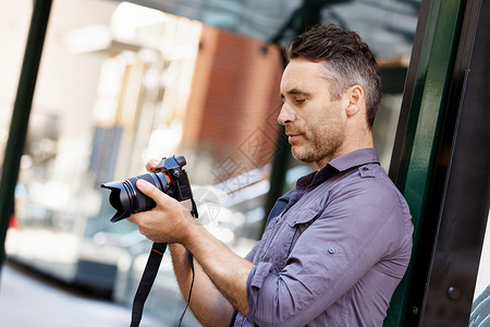 男人照片素材男摄影师拍照专业摄影师城市拍照背景