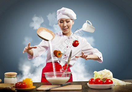 亚洲女烹饪魔术亚洲女烹饪与魔术的颜色背景高清图片