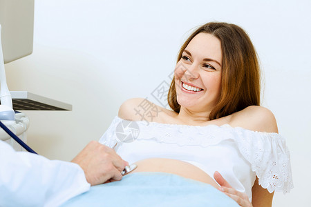孕妇图体检轻孕妇由医生超声检查中检查背景