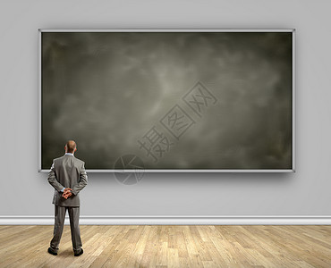 商业教育商人的后视镜看黑板图片