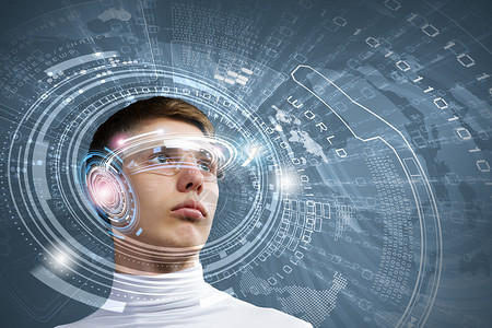 创新技术轻人戴着蓝色背景的未来主义眼镜图片