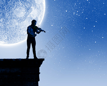 拉小提琴的人轻人晚上月光下拉小提琴图片