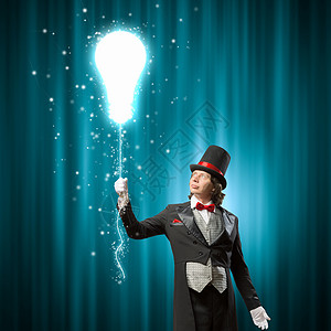 戴帽子的魔术师男子魔术师的形象,魔术与颜色背景变魔术高清图片素材