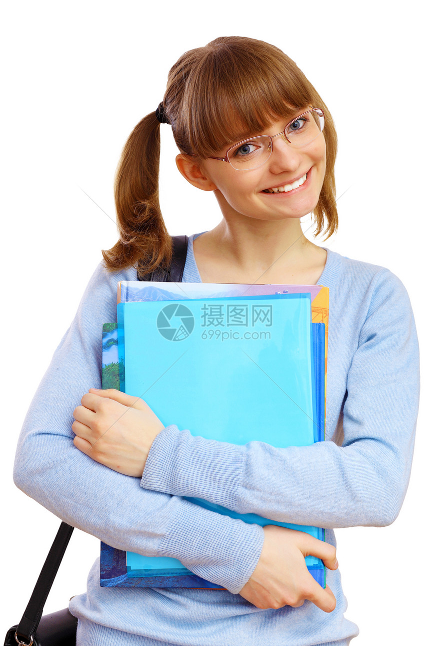 快乐微笑的学生站着拿着书图片