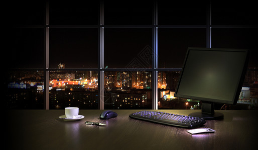 晚上的办公室晚上办公室的工作场所,窗户可以看城市的景色图片
