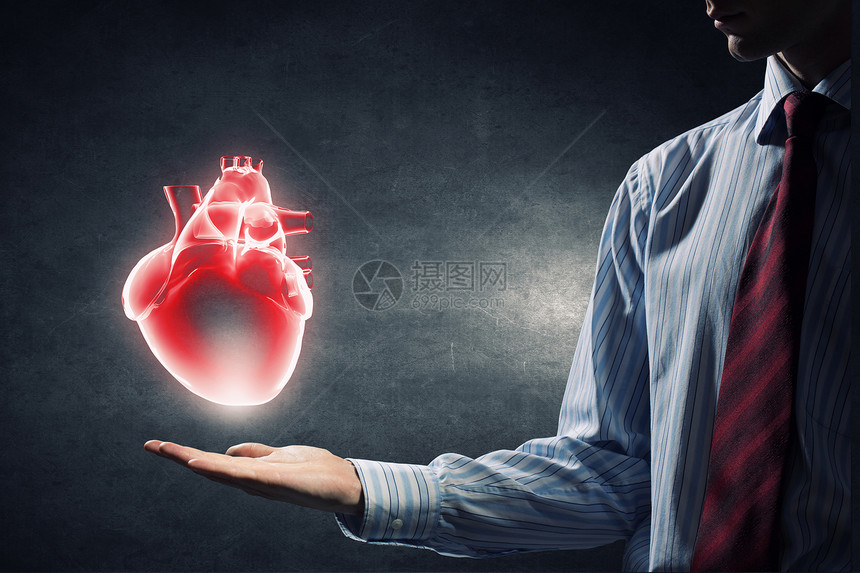 心脏护理的紧紧地握住人类的心图片