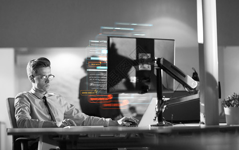 工作狂晚上黑暗的办公室里用电脑工作的轻人师稍后的时间工作设计图片