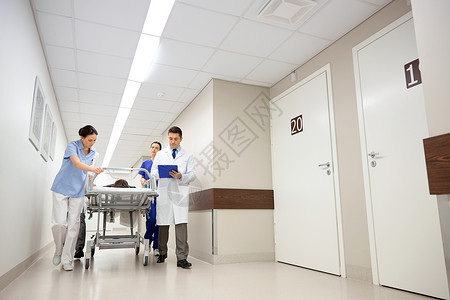 职业,人,医疗保健,复活医学医生医生携带无意识的妇女病人医院轮床上急诊室背景图片