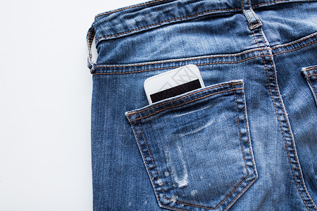 技术通信智能手机口袋牛仔裤牛仔裤牛仔裤牛仔裤口袋里的智能手机图片