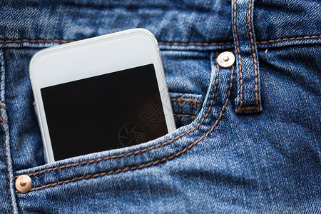 技术通信智能手机口袋牛仔裤牛仔裤牛仔裤牛仔裤口袋里的智能手机图片