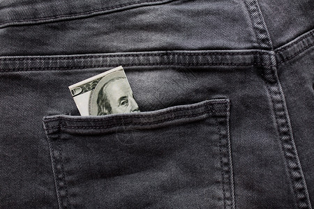 金融,衣服货币美元钱后口袋的牛仔牛仔裤图片