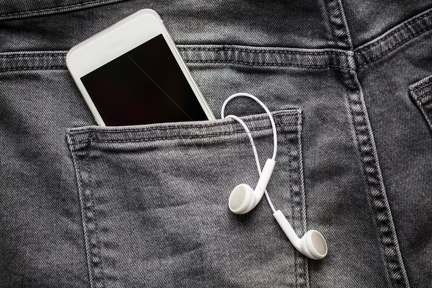 技术,衣服音乐智能手机耳机口袋的牛仔裤牛仔裤牛仔布牛仔裤口袋里的智能手机耳机图片
