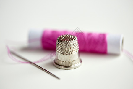 缝合针缝纫针线轴背景